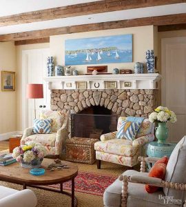 living room tan cobblestone beach theme fireplace