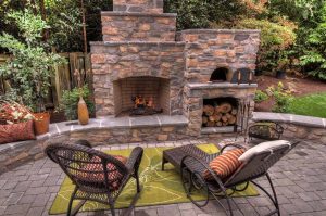 fireplace with pizza oven and fire wood storage 