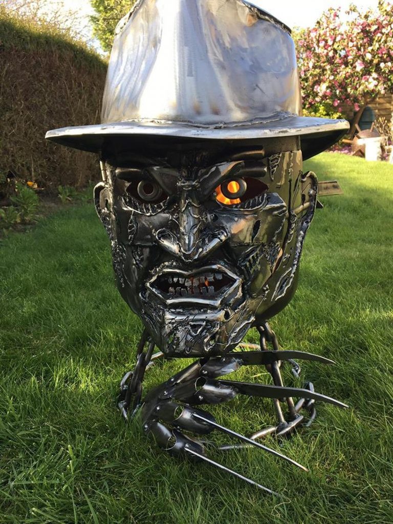 mild steel Freddy Krueger shaped wood burner/fire pit on grass