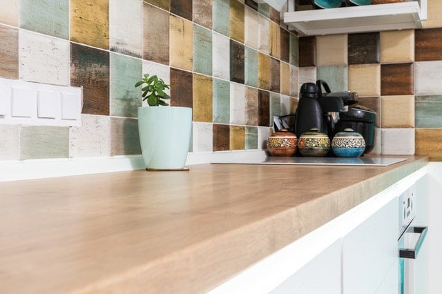 kitchen countertop with multicolor tile backsplash