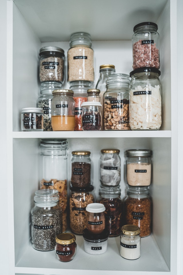 pantry organized in clear jars with labels